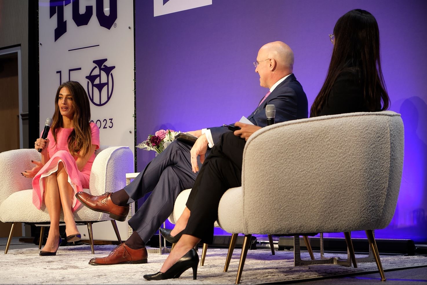 Amal Clooney, Dean Pitcock and Carrie Currier on forum stage